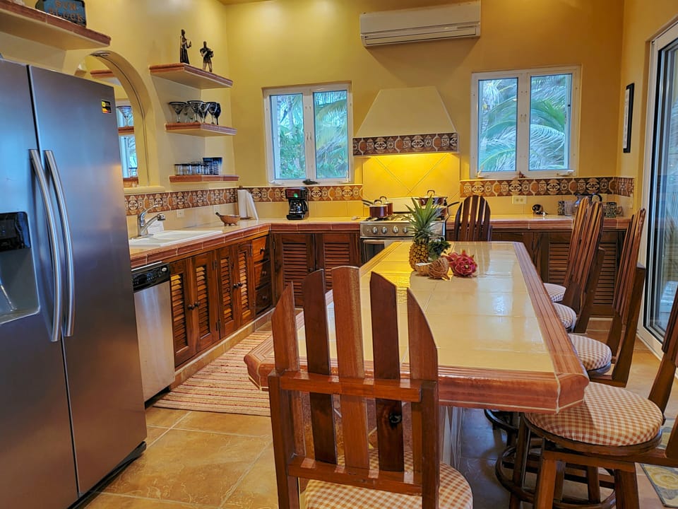 kitchen has beach & ocean views continuous sliding glass FEEL the ocean breezes