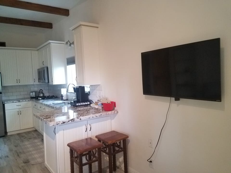 40' HDTV facing bed, kitchen area to left