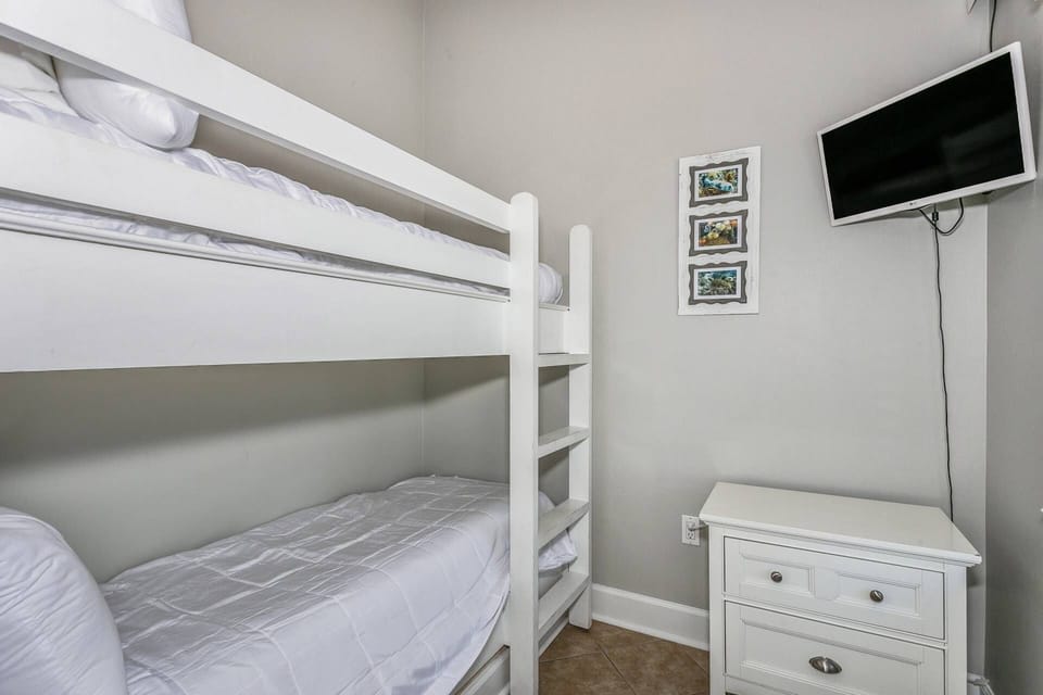The kids will love the bunk beds in the bedroom with access to their own TV