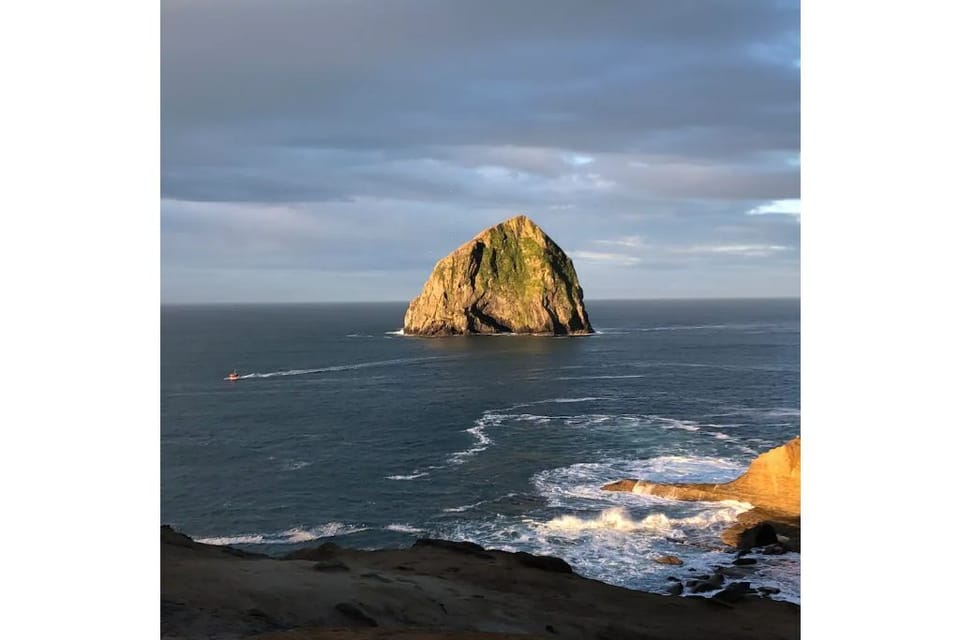 From the Cape Kiwanda viewpoint, enjoy the waves, dory boats, and Haystack Rock.