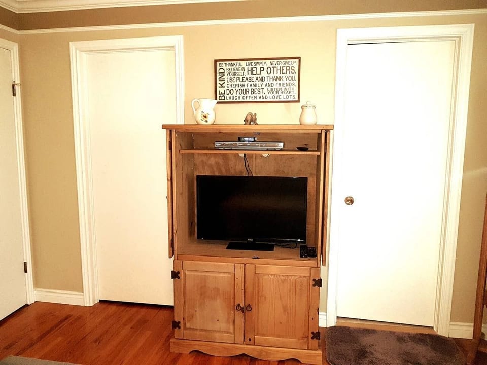 Master Bedroom - Armoire  opens to reveal the second flat screen TV  take note of the lovely natural light.