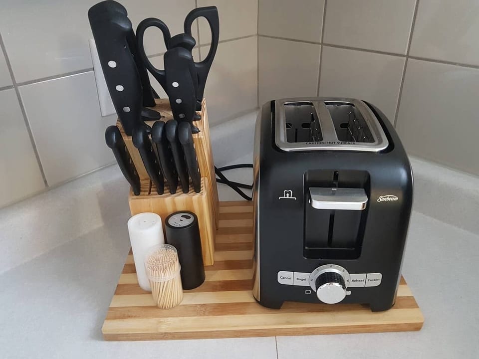 Stocked - Kitchen - Small appliances and food preparation essentials provided.