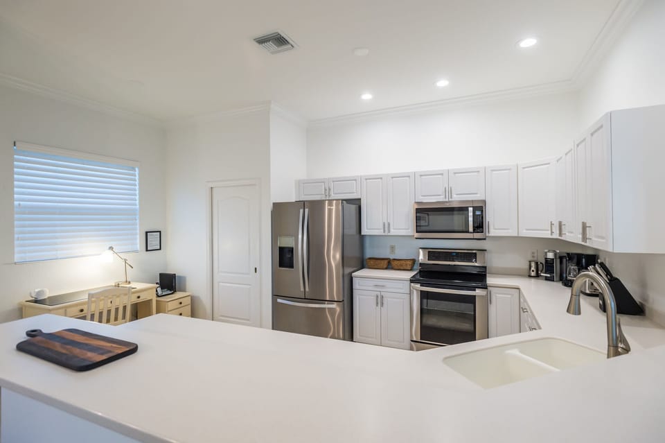 Kitchen with entrance to the laundry room and the garage