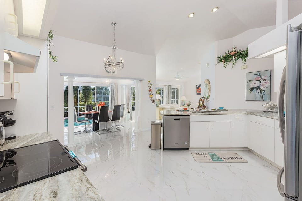 The kitchen is right off the "all season" Florida room where the dining area is