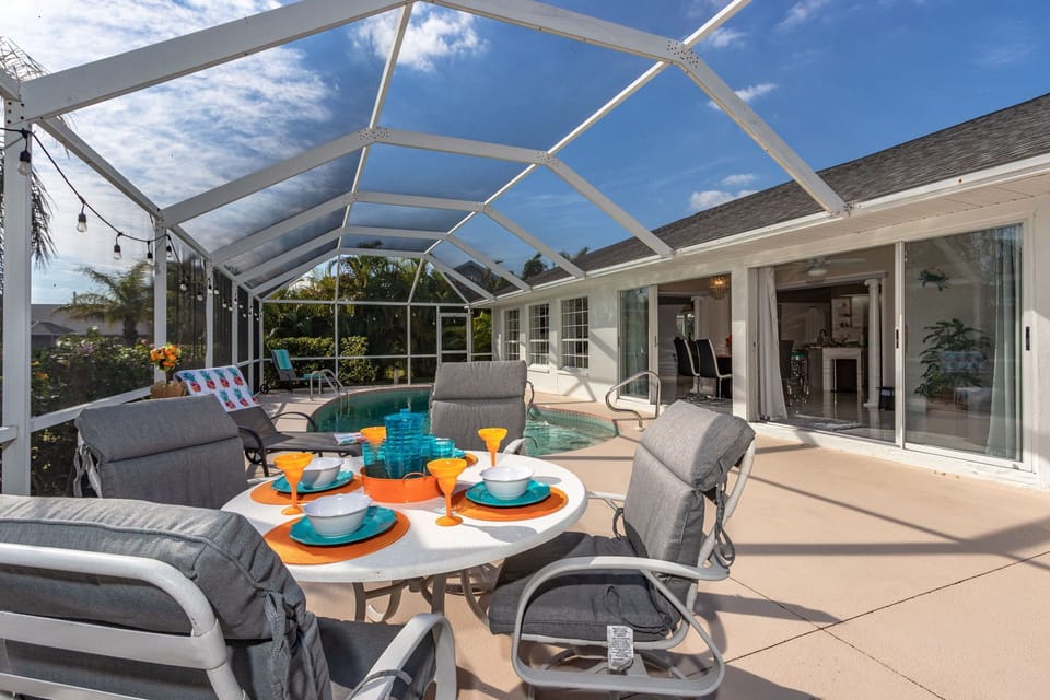 Enjoy meals poolside with the dining area that seats 4
