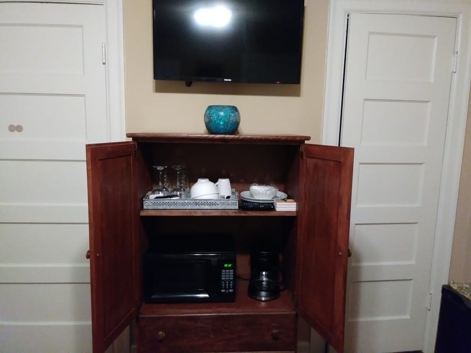 microwave, coffee pot and dishware