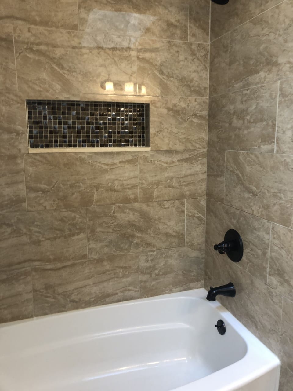 Guest bathroom with tile bath 