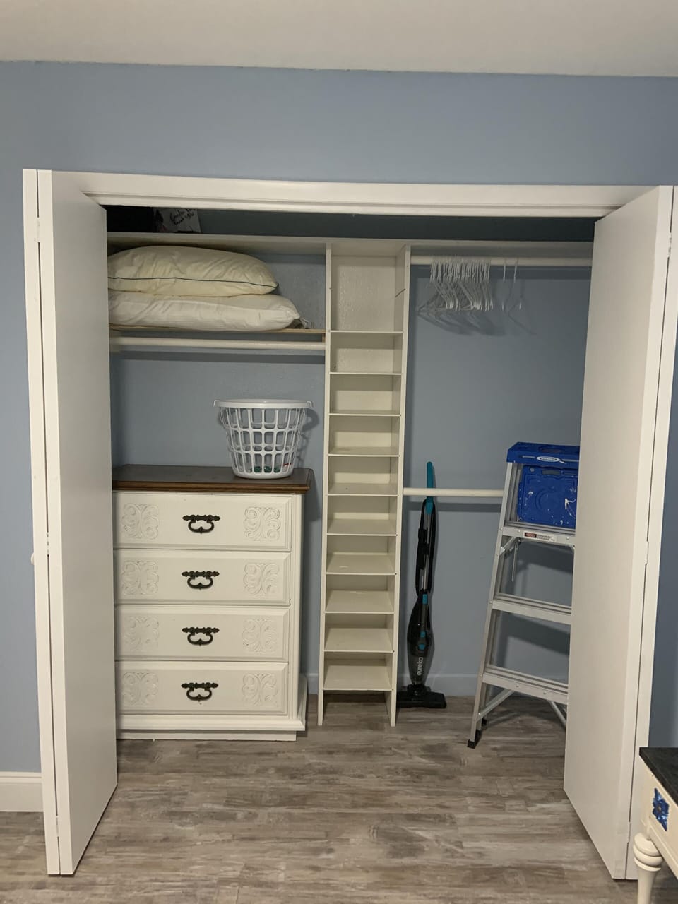 Master closet - extra bed linens, pillow, hangers, vacuum, ladder, laundry needs