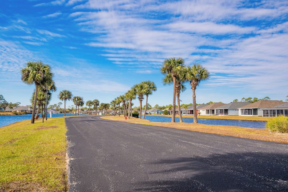 Take a scenic stroll along the palm-lined path with beautiful water views, perfect for relaxing and unwinding