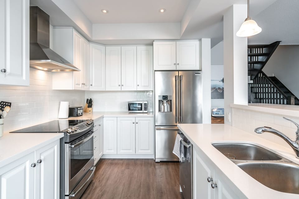 Bright clean kitchen with stainless appliances
