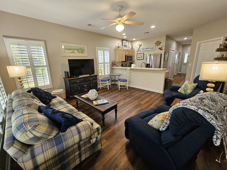 Open living, dining and kitchen space with new flooring, paint and furnishings! 