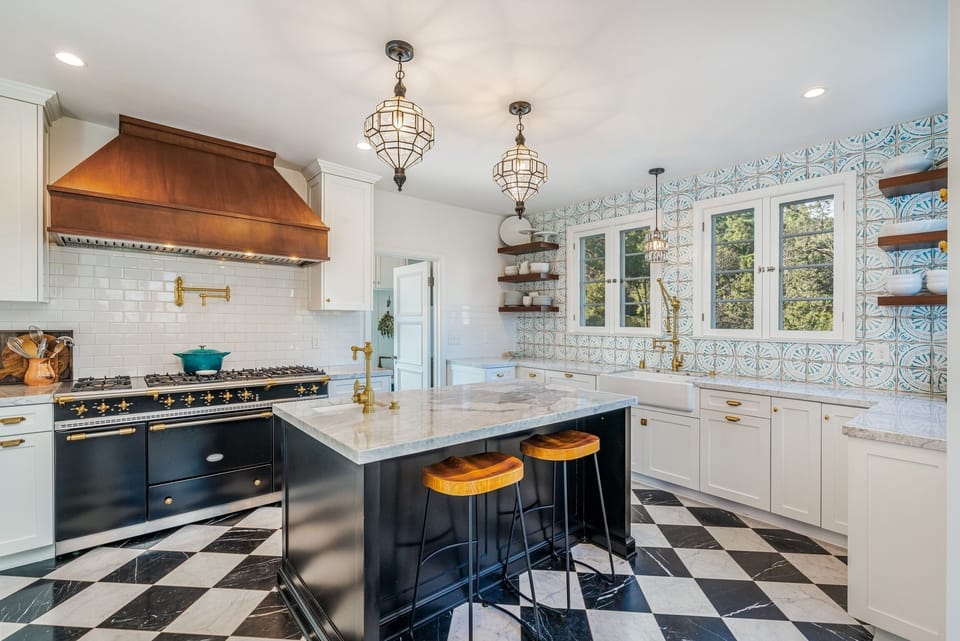 Gourmet kitchen with a one of a kind french range by LaCamche. 