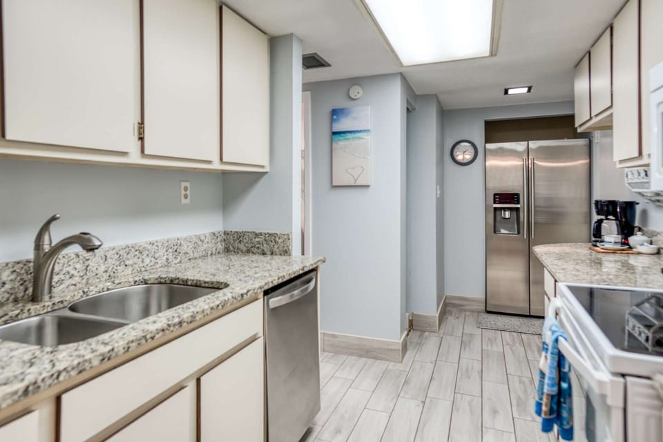 Kitchen is fully equipped with dishwasher, stove, oven and microwave.