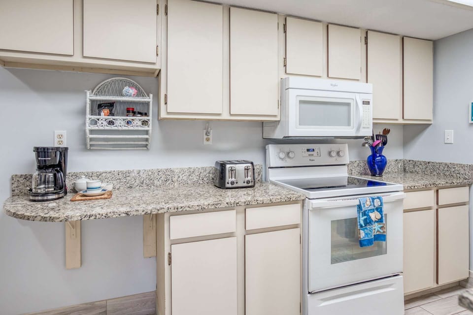 Kitchen is equipped with the essentials for making this home your home away from home.