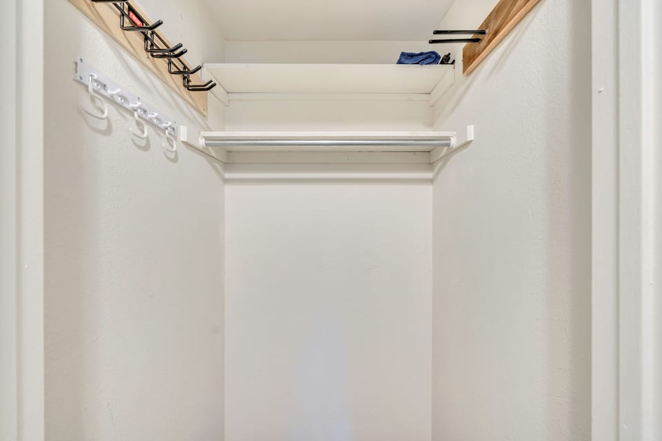 Large hall closet. Ski rack, snow board and boot tray.
