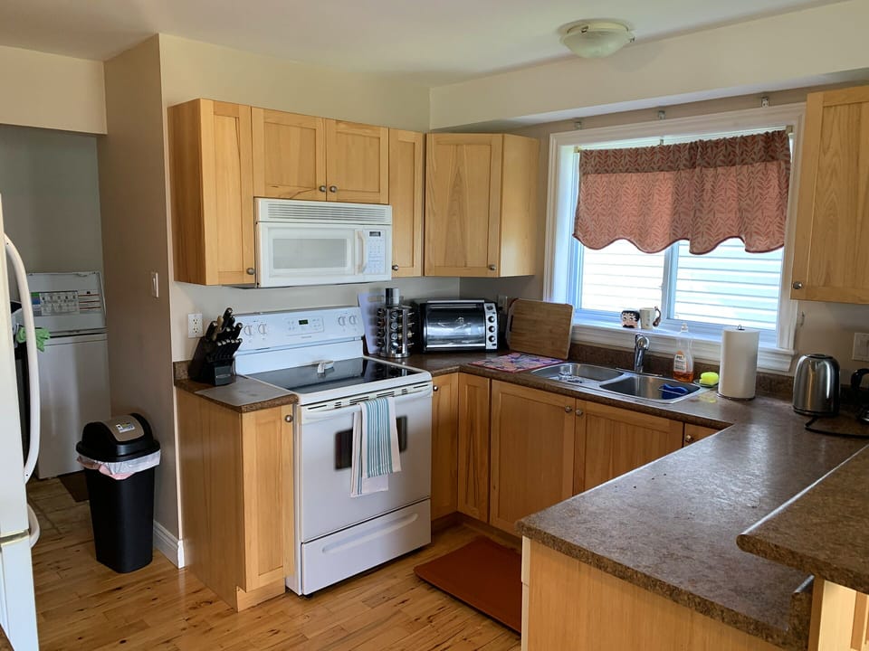 Fully stocked kitchen, all appliances, utensils, cookware, wine glasses etc.