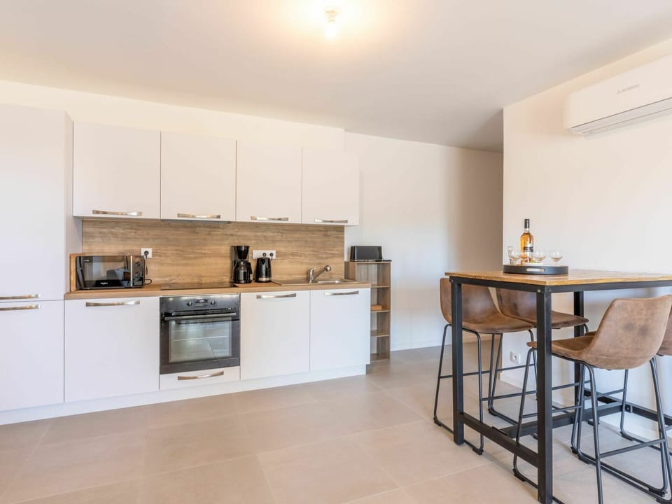Cabinetry, Property, Countertop, Furniture, Building, Wood, Kitchen Stove, Kitchen, Table, Interior Design