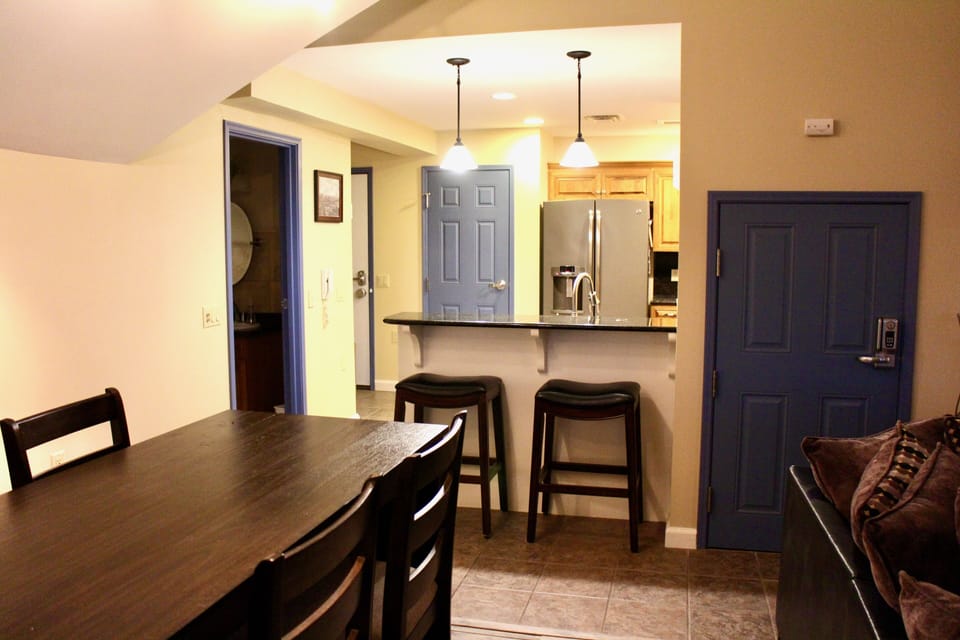 Dining area adjacent to kitchen; half-bath on left