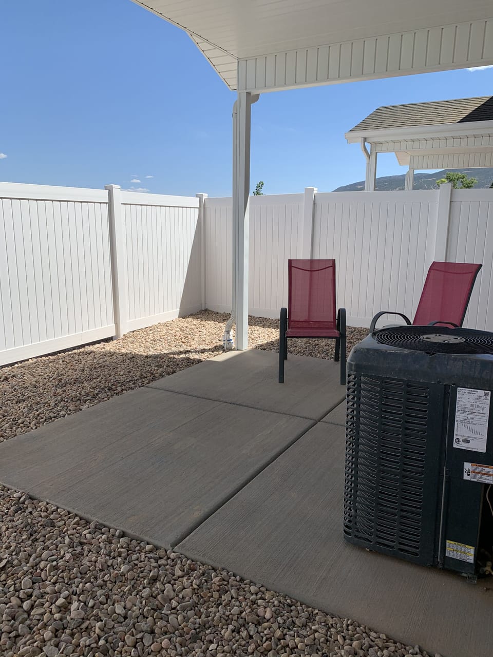 Covered patio with privacy fence.