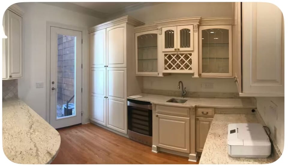 The right side view of the kitchen leading out to the patio in back