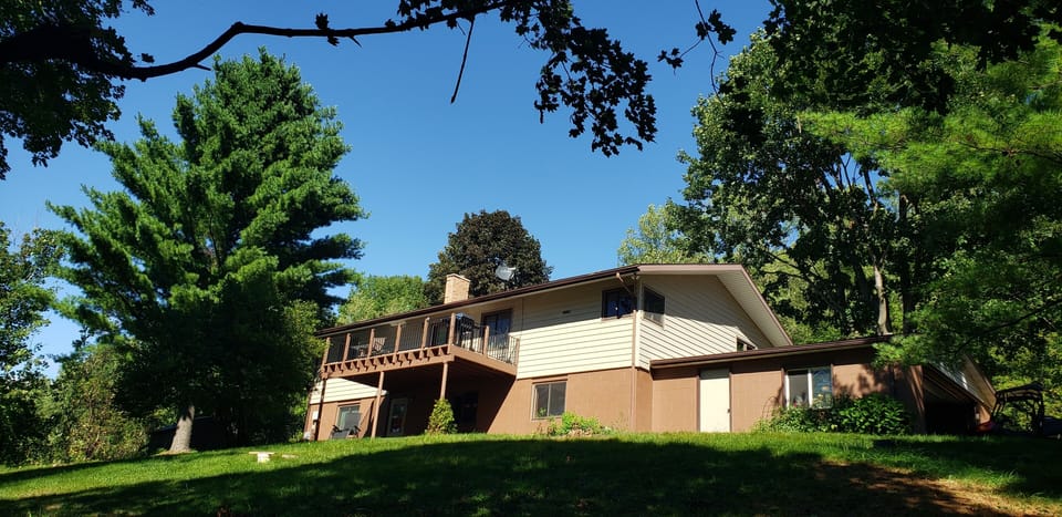 A large deck and covered patio overlooking the Coulee Bluffs