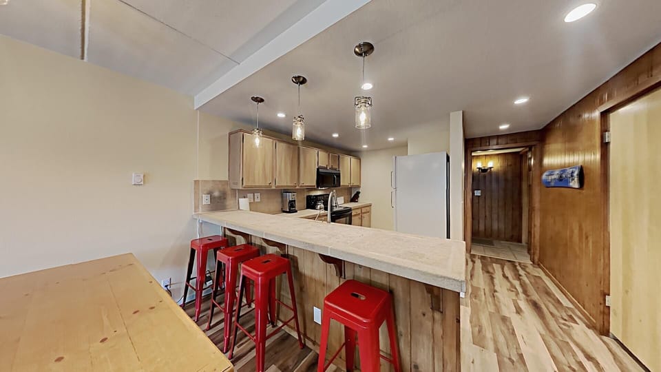 Fully-Equipped Kitchen with Bar Seating for Reconnecting