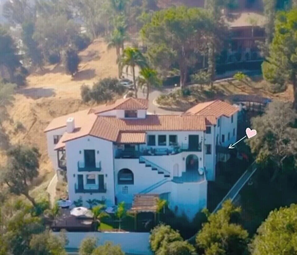 The wide shot of the home and entrance to the apartment 