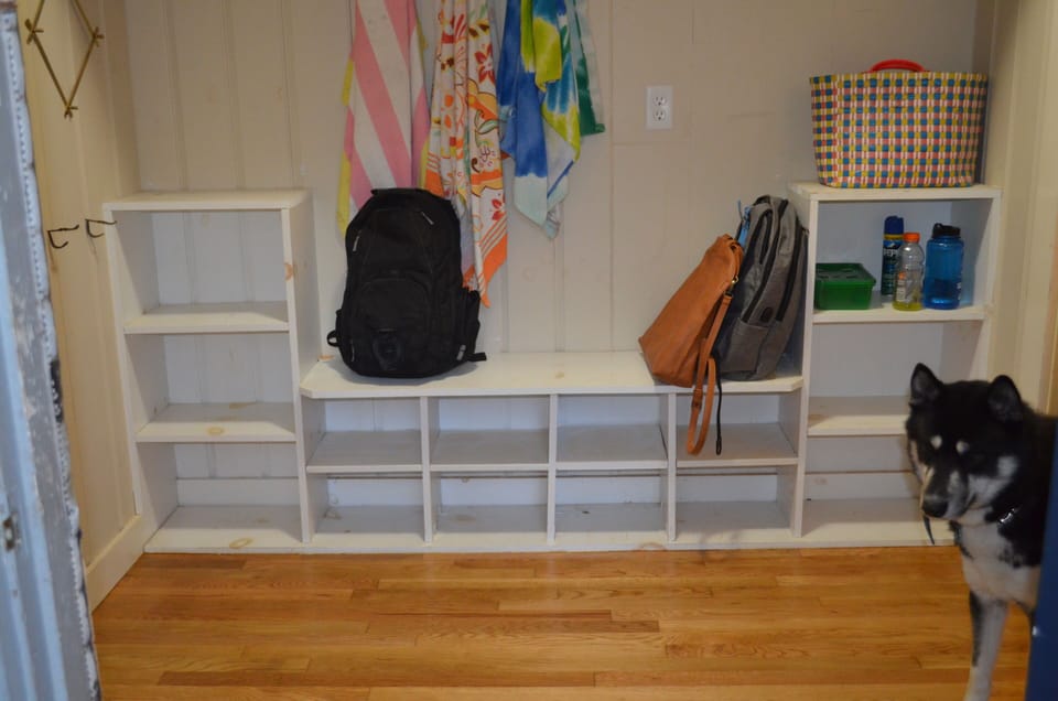 Left front entryway storage - great for after the lake!  Dog not included :)