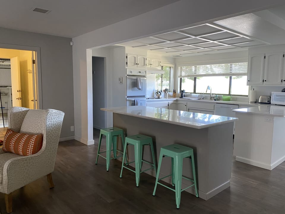Another view of the kitchen, with island seating
