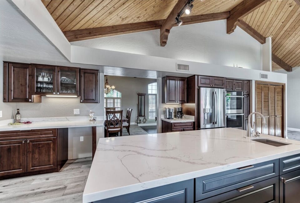 Vaulted kitchen with view to dining room / game room