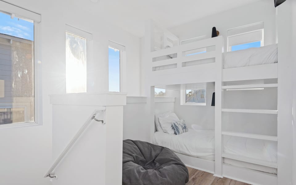 The third floor, a fun hang out, features twin bunks, and a flat screen tv.