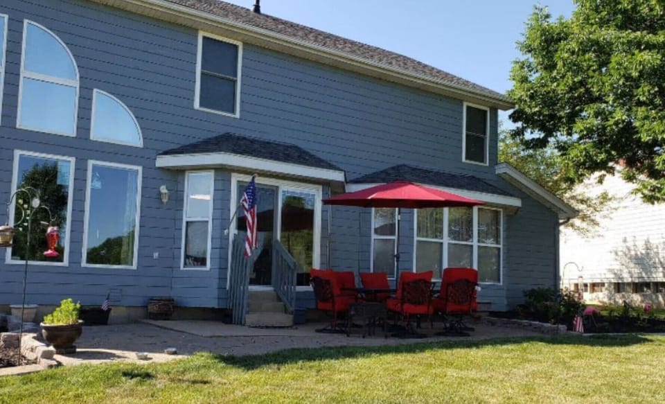Patio with furniture, barbecue grill overlooking the golf course