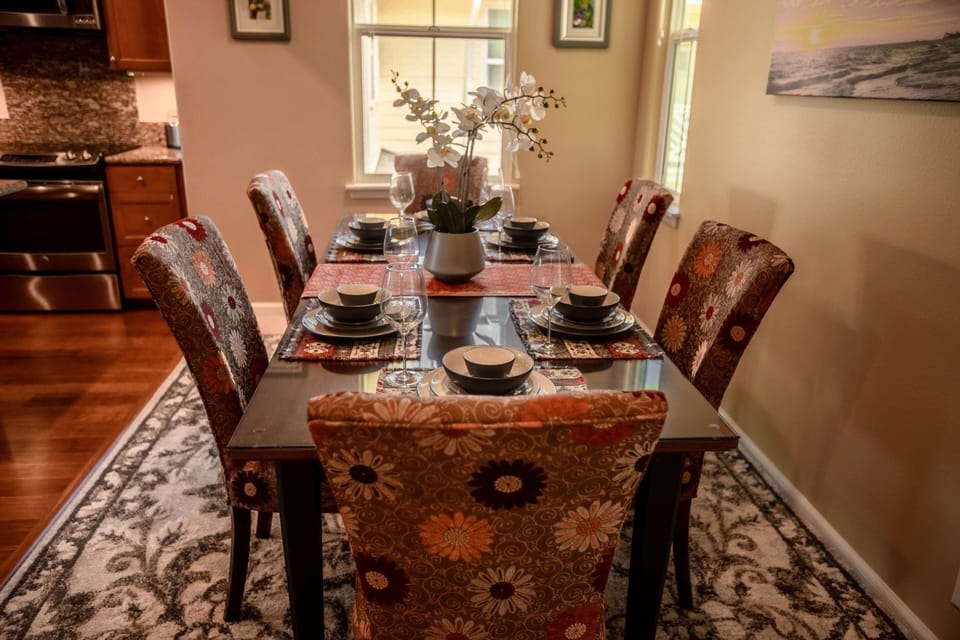 Elegant dining area with seating for six, perfect for shared family meals.