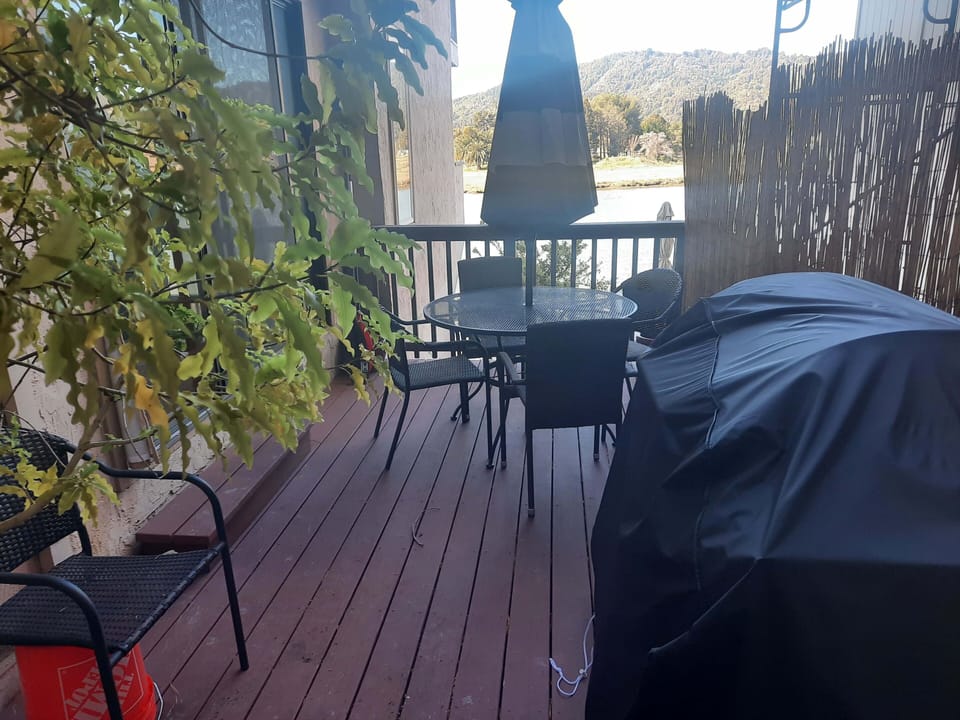 Side deck, with gas bbq and small garden, adjoins second bedroom.