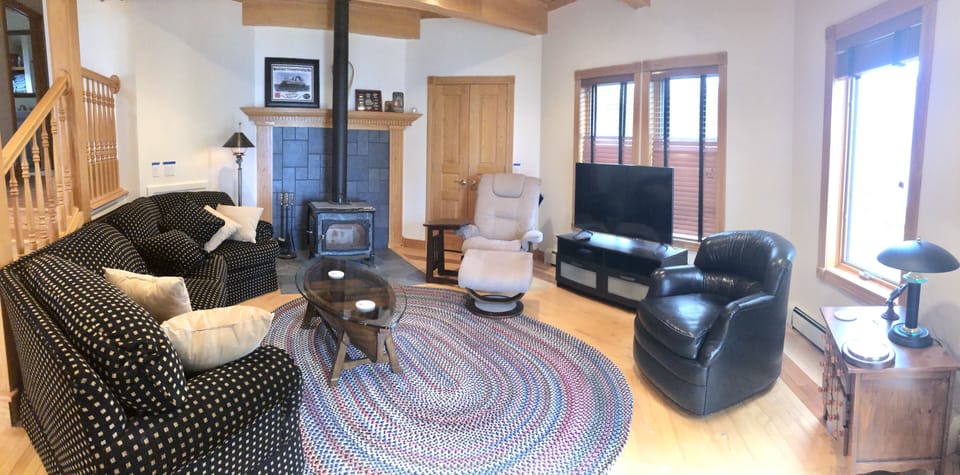 Main living room adjacent to kitchen,dining and deck.