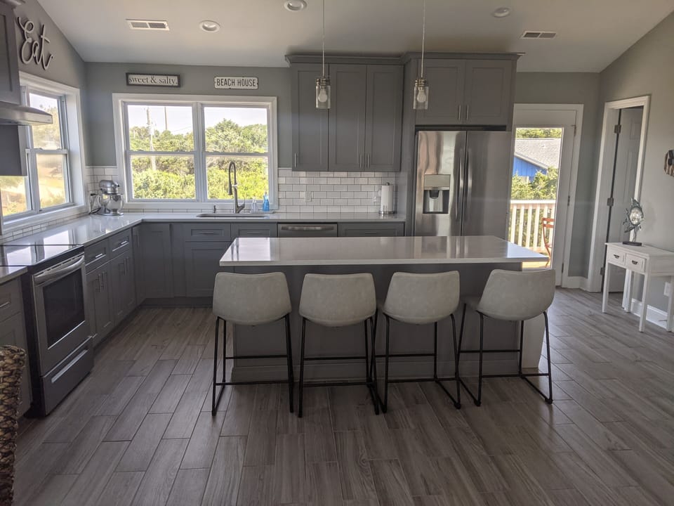 Large, spacious kitchen perfect for entertaining. Island seats 4. Walk-in pantry