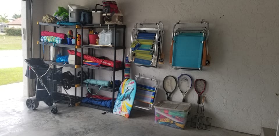 Beach equipment, chairs. 2 beach carts, 4 coolers,  toys, floats, fishing poles.