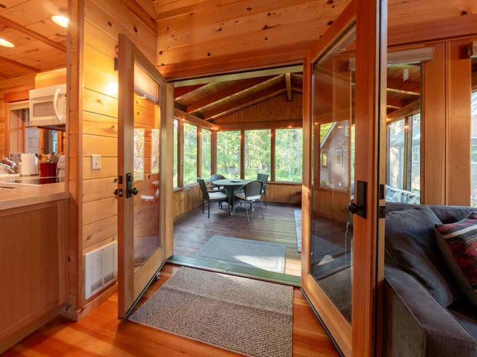 Looking into screened in porch from living room double doors