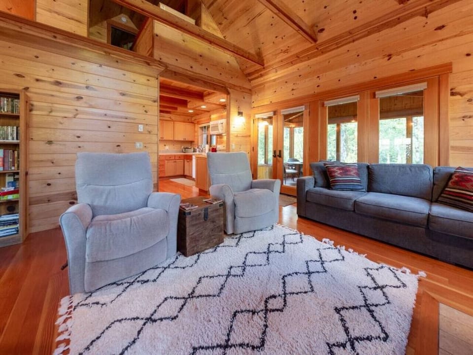 Living room with river rock fireplace