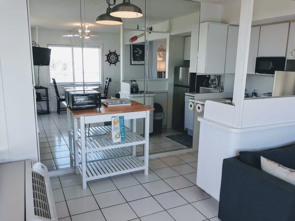 Butcher block, toaster oven, shelves & drawer to store anything you may bring.