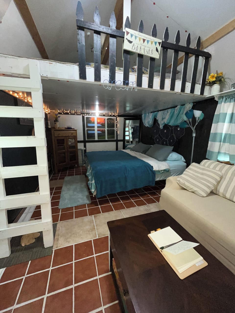 The table in front of the couch pulls up and makes a desk