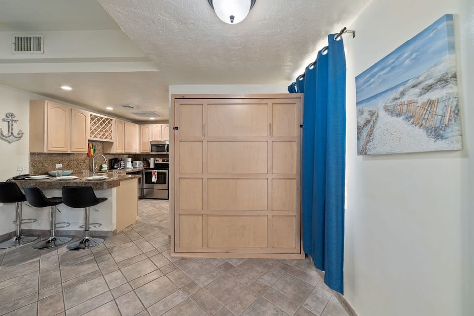 Discreet and space-saving Murphy bed easily folds into the wall to maximize living space.