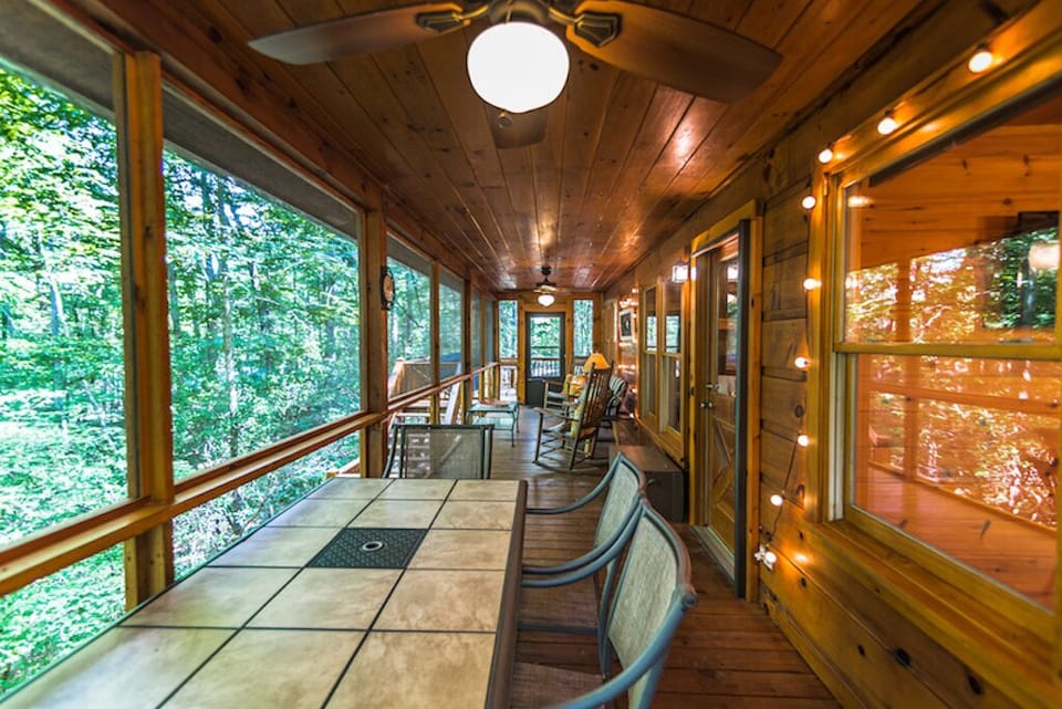 Screened in porch with dining table
