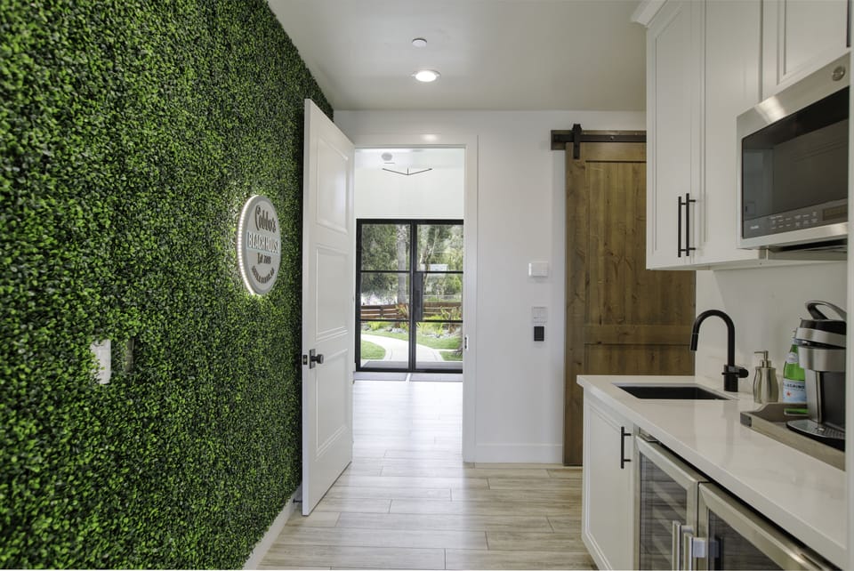 Cobboo's Beach House instagram wall and kitchenette