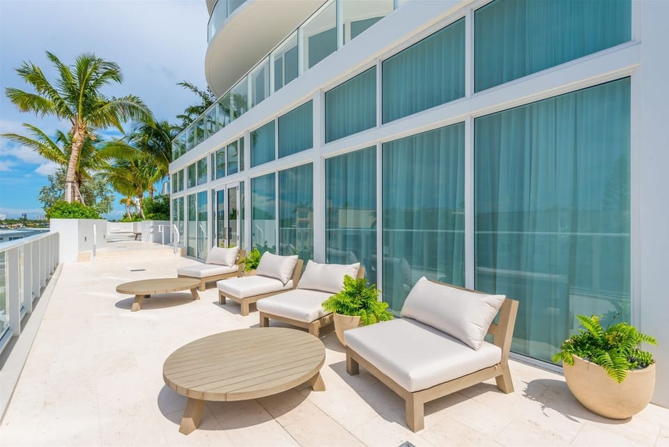 Outdoor terrace offers cushioned sun loungers