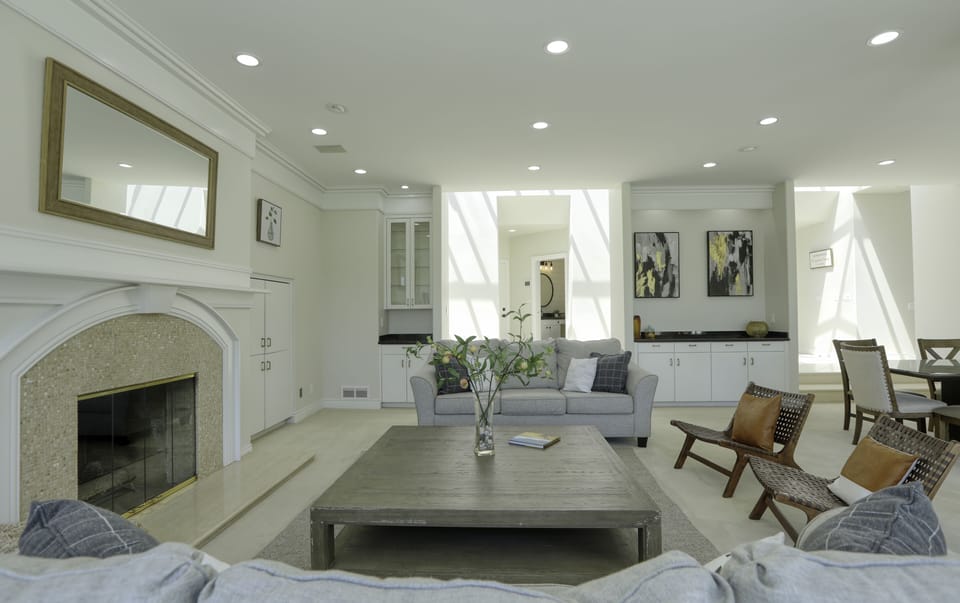 The great room is spacious with plenty of chairs and couches to lounge.