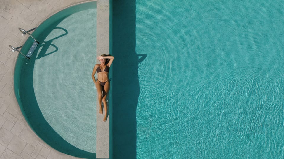 Dive into our 42m² pool, framed by lush gardens and Cretan serenity.
