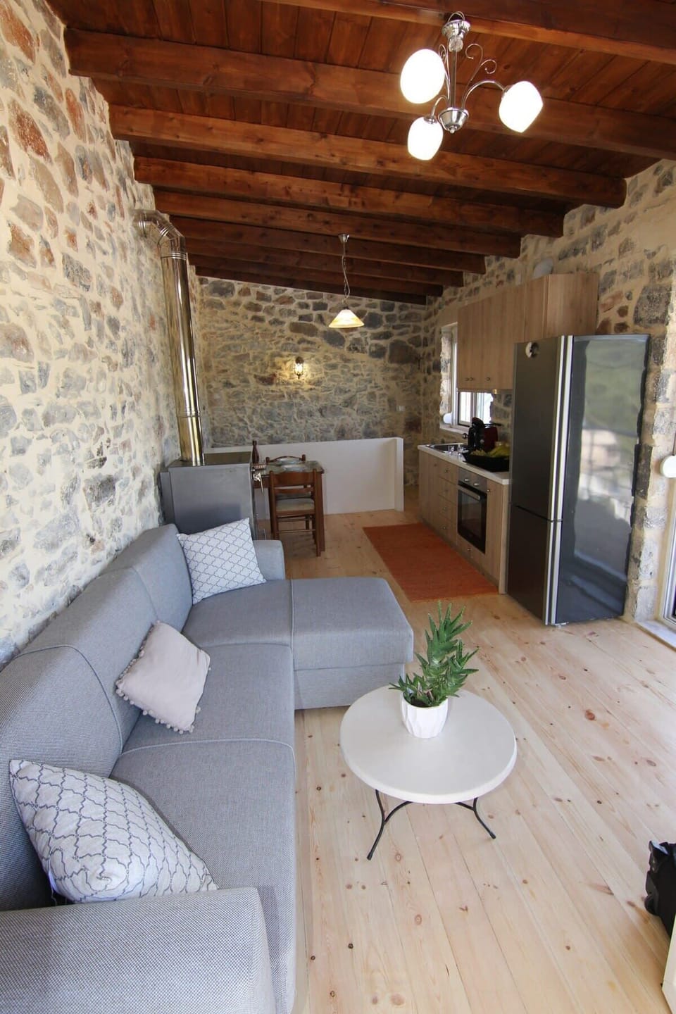 Lounge Area with Authentic Stone Design – Traditional charm blended with comfort for a welcoming stay.