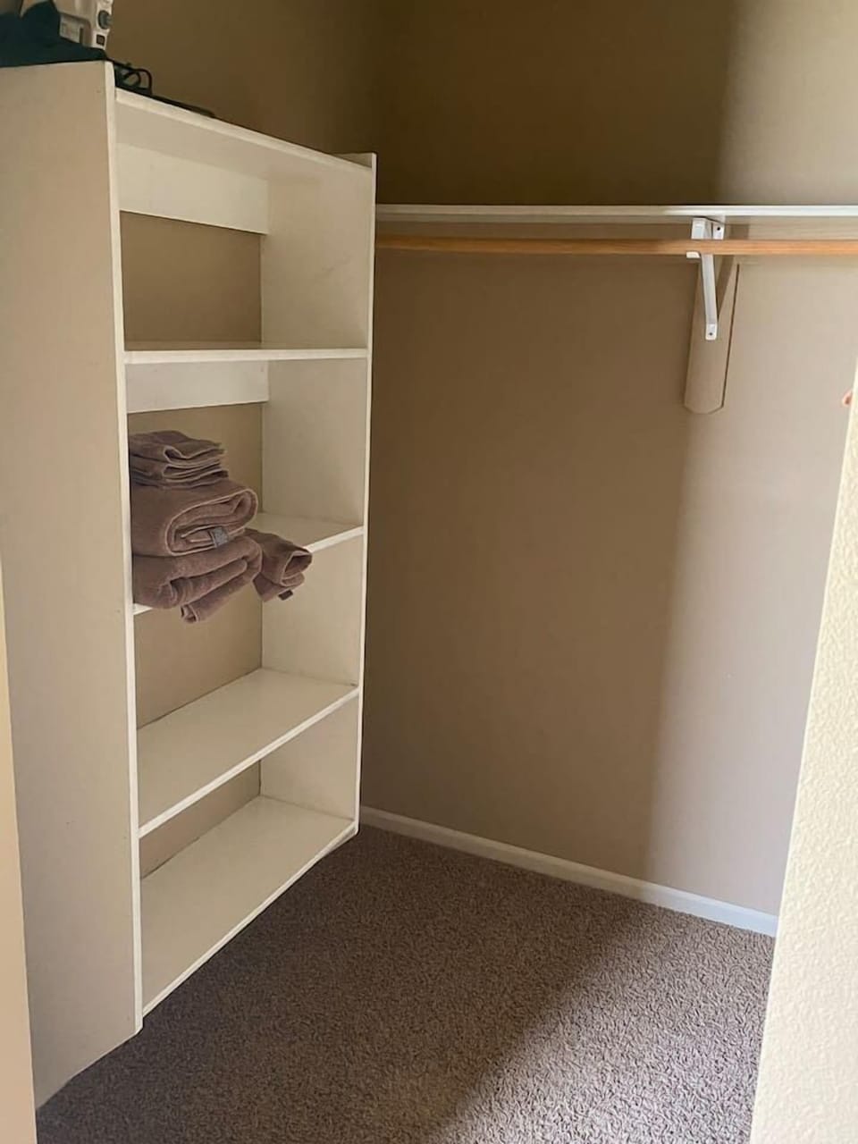 Primary bedroom walk in closet.