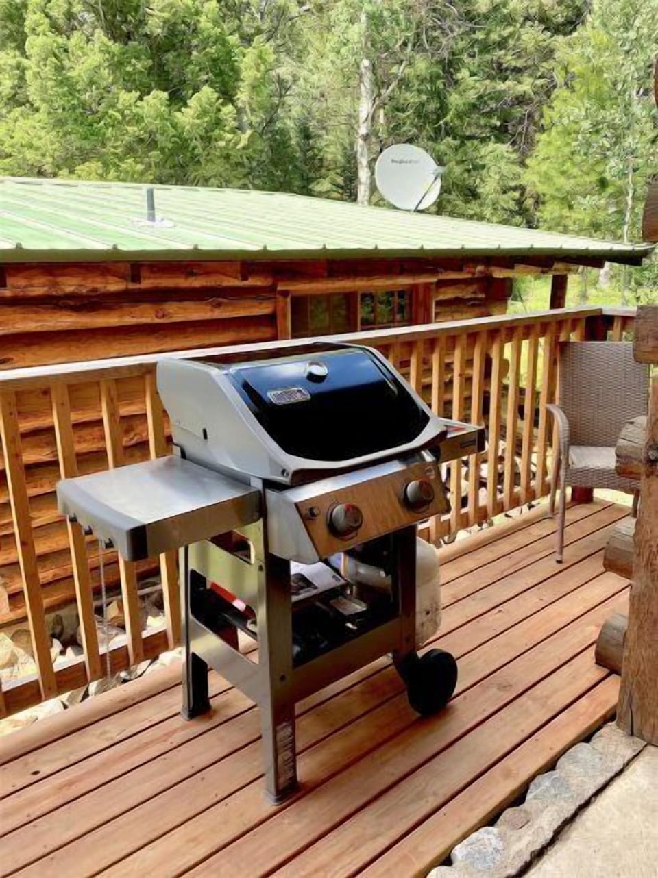 Gas grill and smaller area to sit on the front porch/entry to cabin